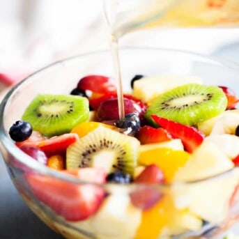 Rainbow Fruit Salad with Honey Lime Dressing from iamhomesteader.com