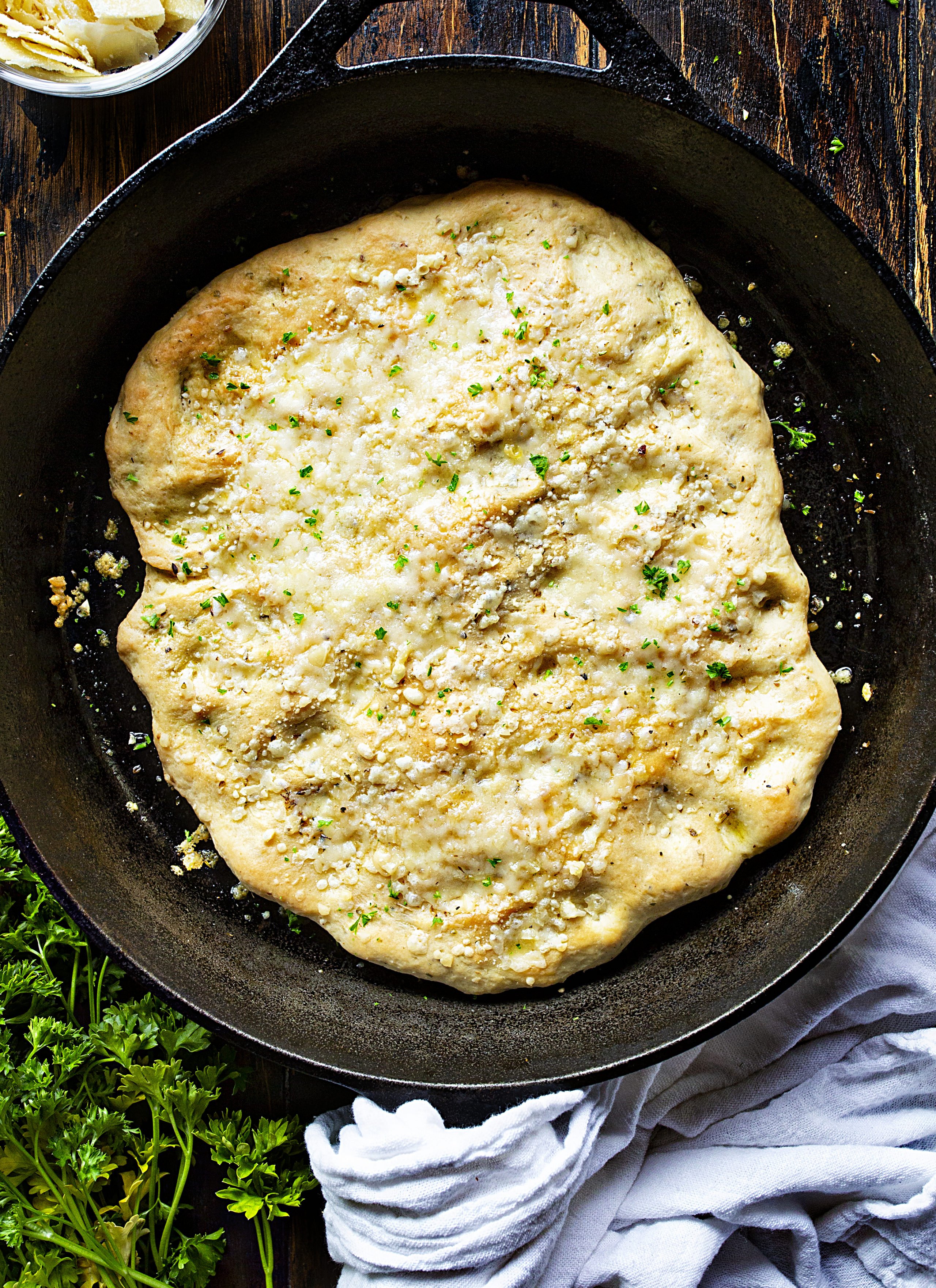 Baked Italian Focaccia Bread! #Focacciabread #focaccia #breadrecipes #sandwichbread #homemadefocacciabread #homemadebread #noyeastbreads Easy Skillet Focaccia on Wooden Surface
