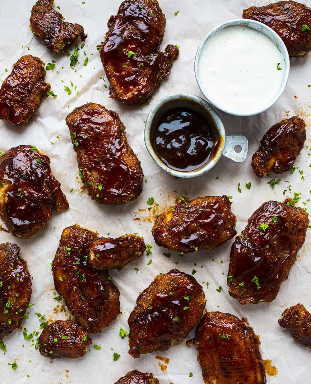 Overhead View of cooked BBQ Chicken Tenders with Ranch and more BBQ sauce