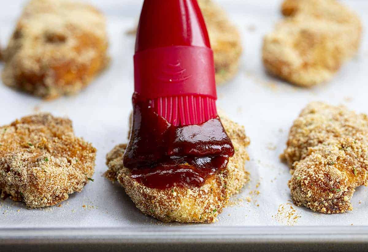Brushing BBQ Sauce Over Homemade Chicken Tenders