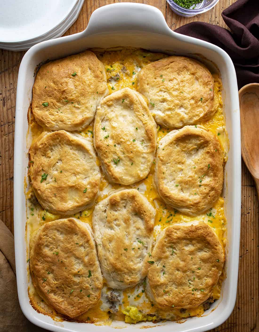 Biscuits and Gravy Casserole is a layer of refrigerator biscuits that are topped and baked with eggs, breakfast sausage, gravy, cheddar cheese, and another layer of biscuits. Breakfast, Biscuits and Gravy Breakfast, Breakfast Casserole, Eggs and Gravy, Baked Breakfast, Casserole, Recipes, gravy, biscuits, i am homesteader, iamhomesteader Overhead of Casserole Dish with Biscuits and Gravy and Eggs