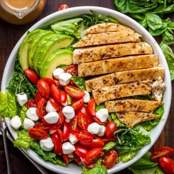 Cooked and Assembled Easy Chicken Caprese Salad from Overhead on Butcher Block