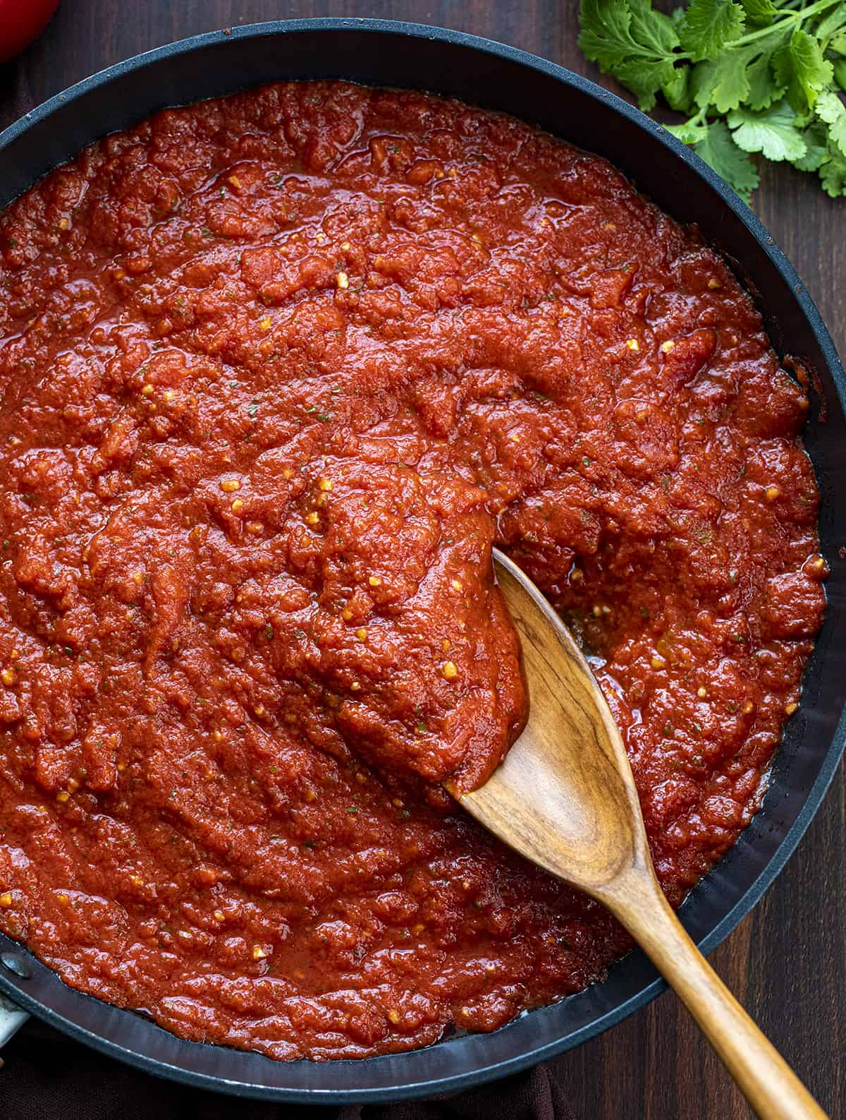 Pan of Cooked Marinara with Wooden Spoon. Sauces, Marinara, How to Make Marinara, Best Marinara, Easy Marinara, Dip, Appetizers, i am homesteader, iamhomesteader