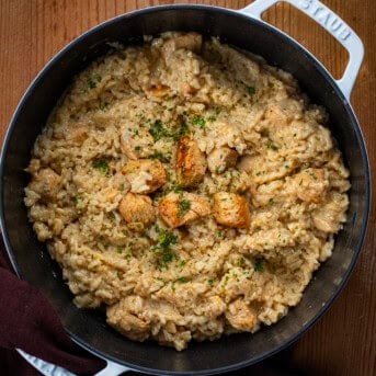 Pot of Cajun Chicken and Rice on a wooden table.