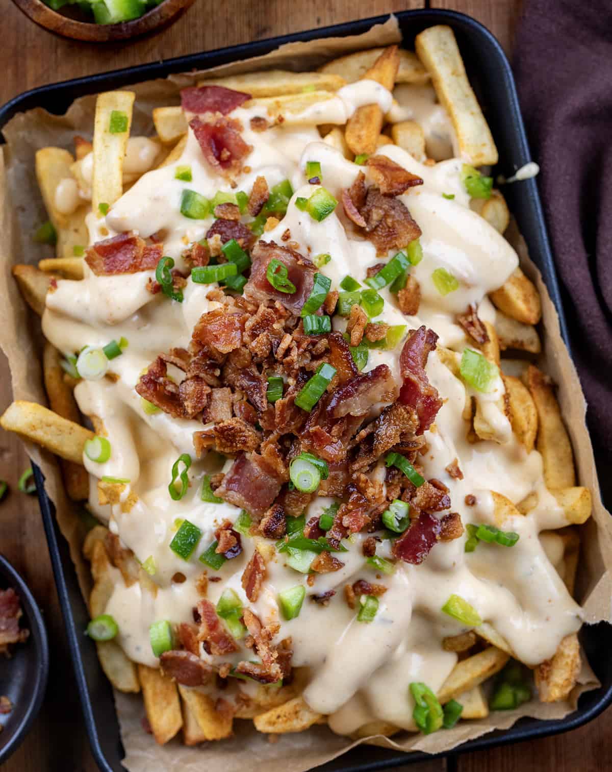 Tray of Wingstop Copycat Voodoo Fries on a wooden table from overhead. 